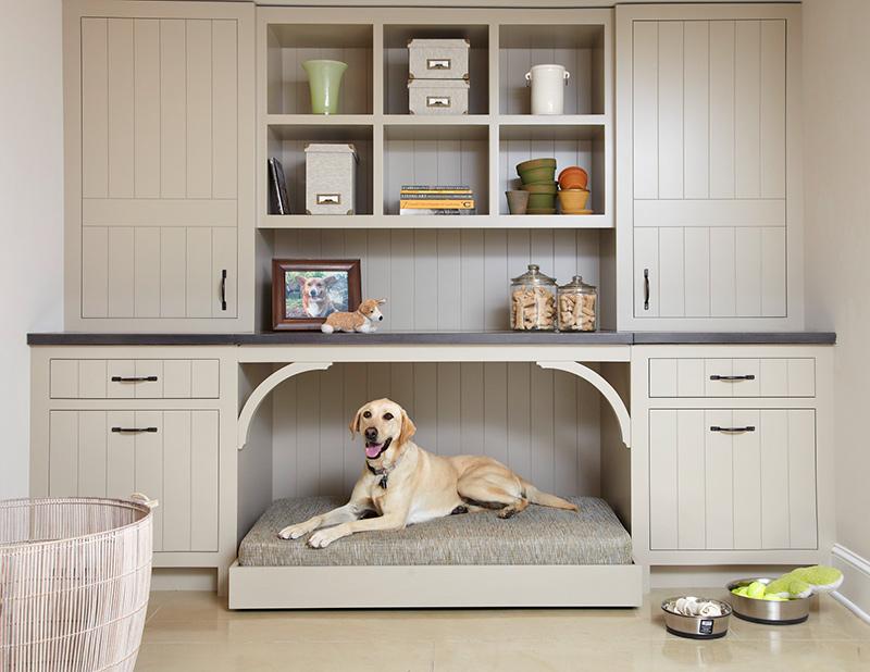 A dog in a pet nook. A big storage cabinet with a built in dog bed. Image courtesy of decoist.com